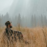 Man sitting alone in a field